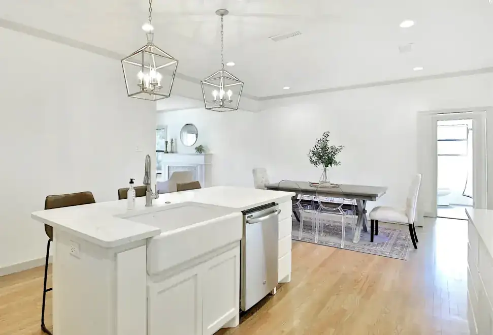 Grand Avenue kitchen island with a farmhouse sink and pendant lights