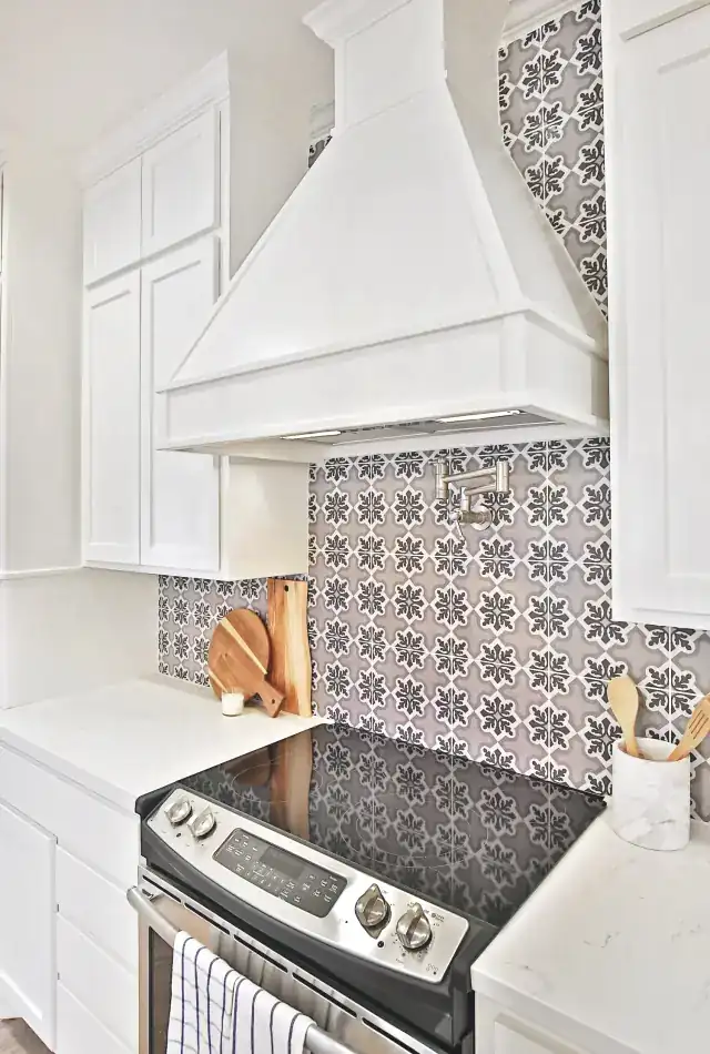 Patterned gray and white tile behind the Grand Avenue range