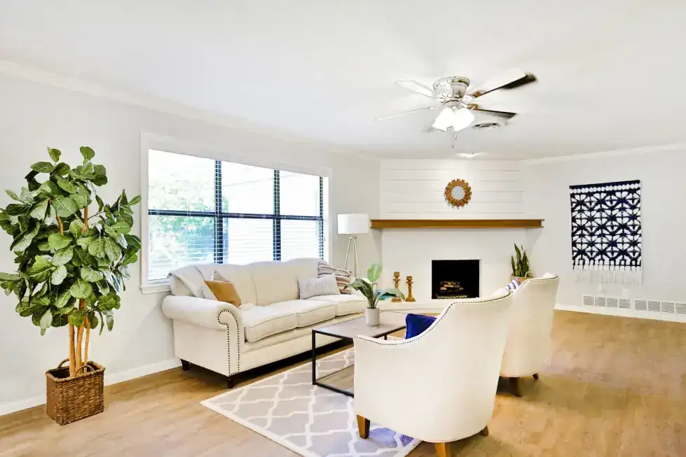 High Meadows living room with a fireplace and wood floors