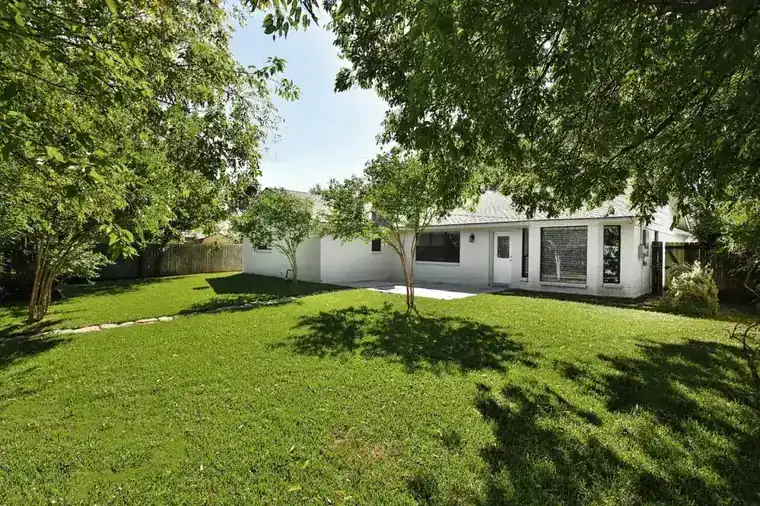 High Meadows back lawn under shade trees